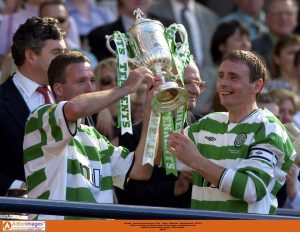 Celtic's Tom Boyd and Paul Lambert lift the trophy to celebrate the win