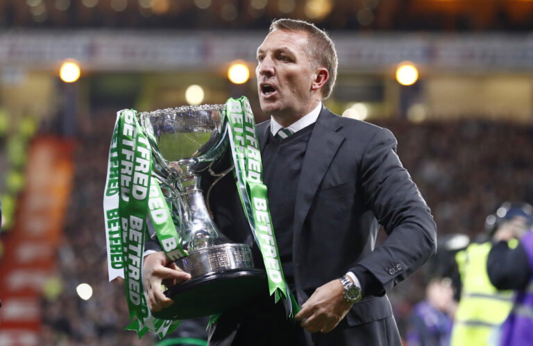 Rodgers with the League Cup and the Celtic ribbons on it.