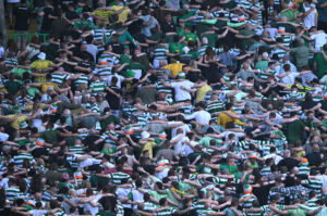 Celtic fans. Huddling.