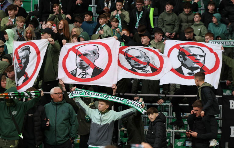 Collective. Celtic fans together against the board.