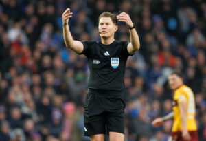 Referee David Dickinson cheats Motherwell out of a penalty at Ibrox.