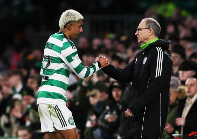 Celtic's new bhoy takes the congrats of the manager.
