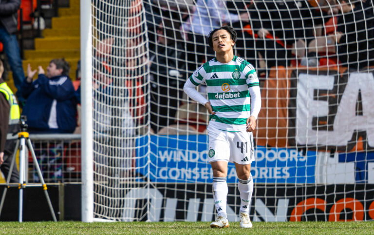 Celtic players look dejected.