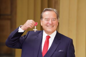 Jeff Stelling with his wee medal from the Palace. Clown.